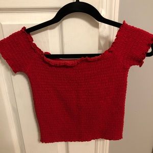 red off the shoulder ribbed shirt
